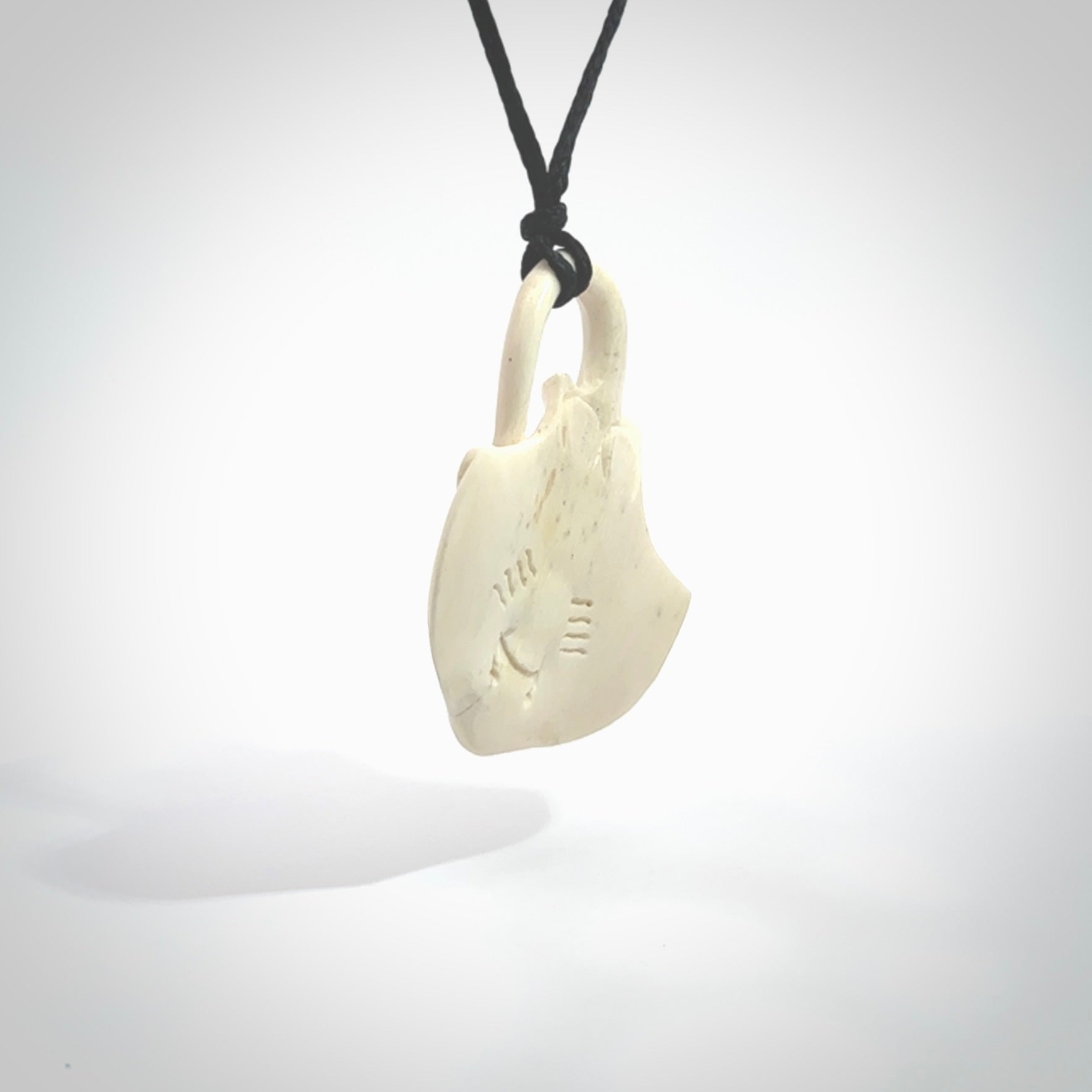 Hand carved stingray pendant. Natural bone pendants from NZ Pacific.