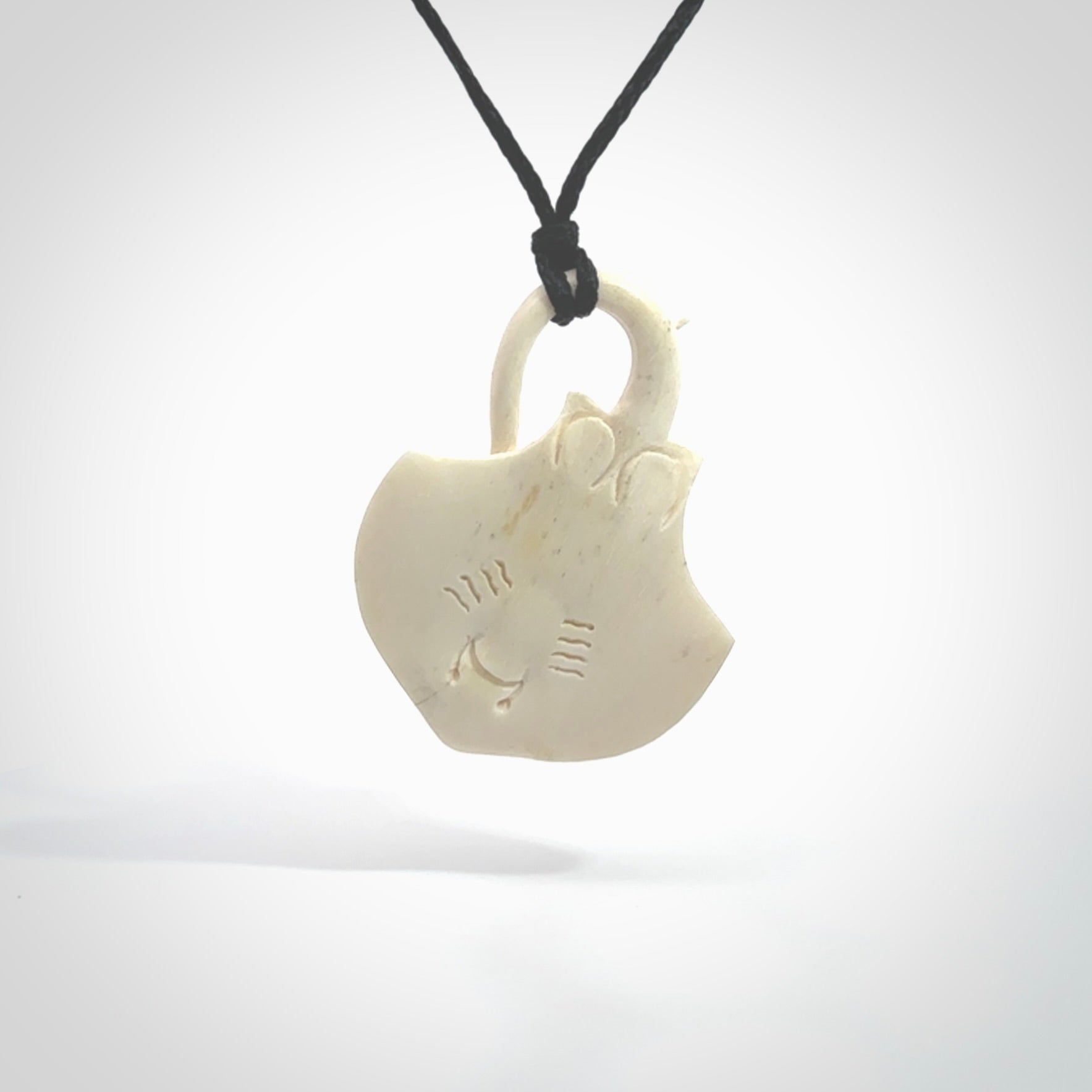 Hand carved stingray pendant. Natural bone pendants from NZ Pacific.