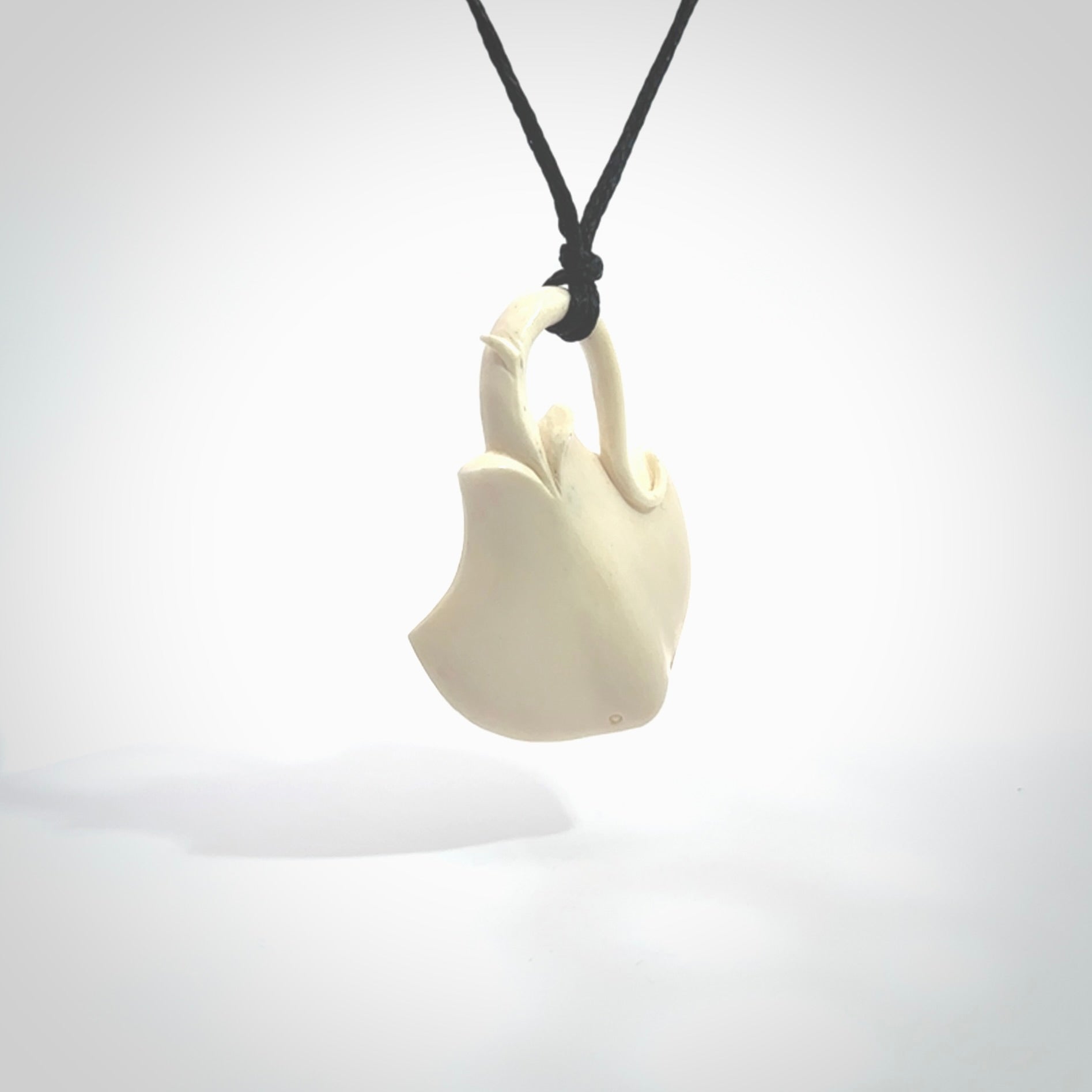 Hand carved stingray pendant. Natural bone pendants from NZ Pacific.