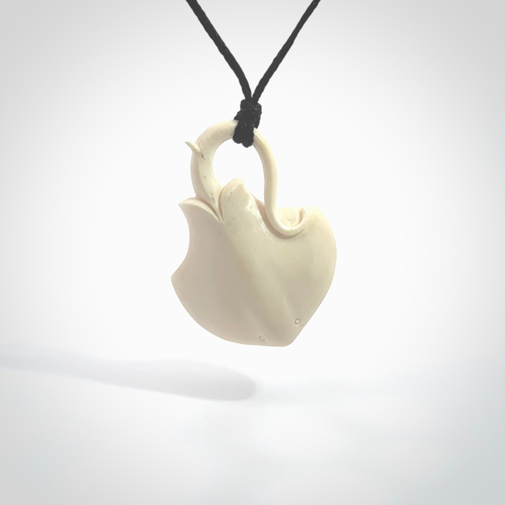 Hand carved stingray pendant. Natural bone pendants from NZ Pacific.