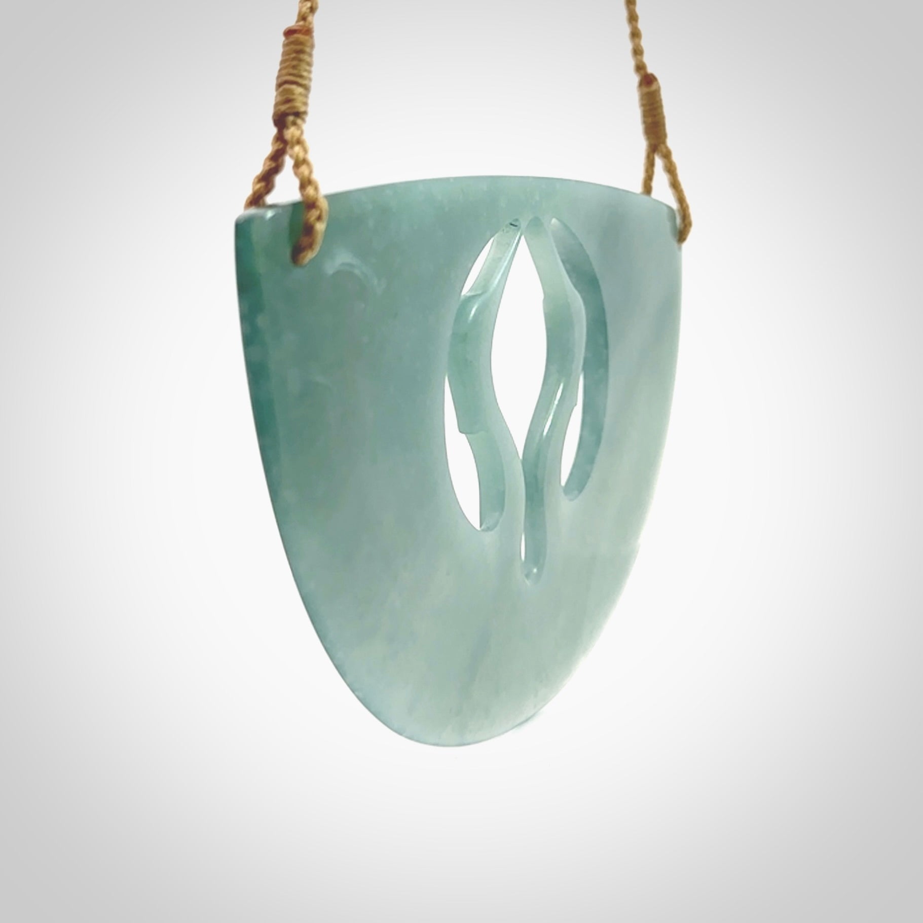 This large piece is a hand carved double Kotuku (white heron) bird breastplate pendant. Kerry carved this from Guatemalan Jade. It is a gorgeous blue colour and is an artistic piece of jewellery. Hand made by Kerry Thompson and delivered to you in a kete pouch.