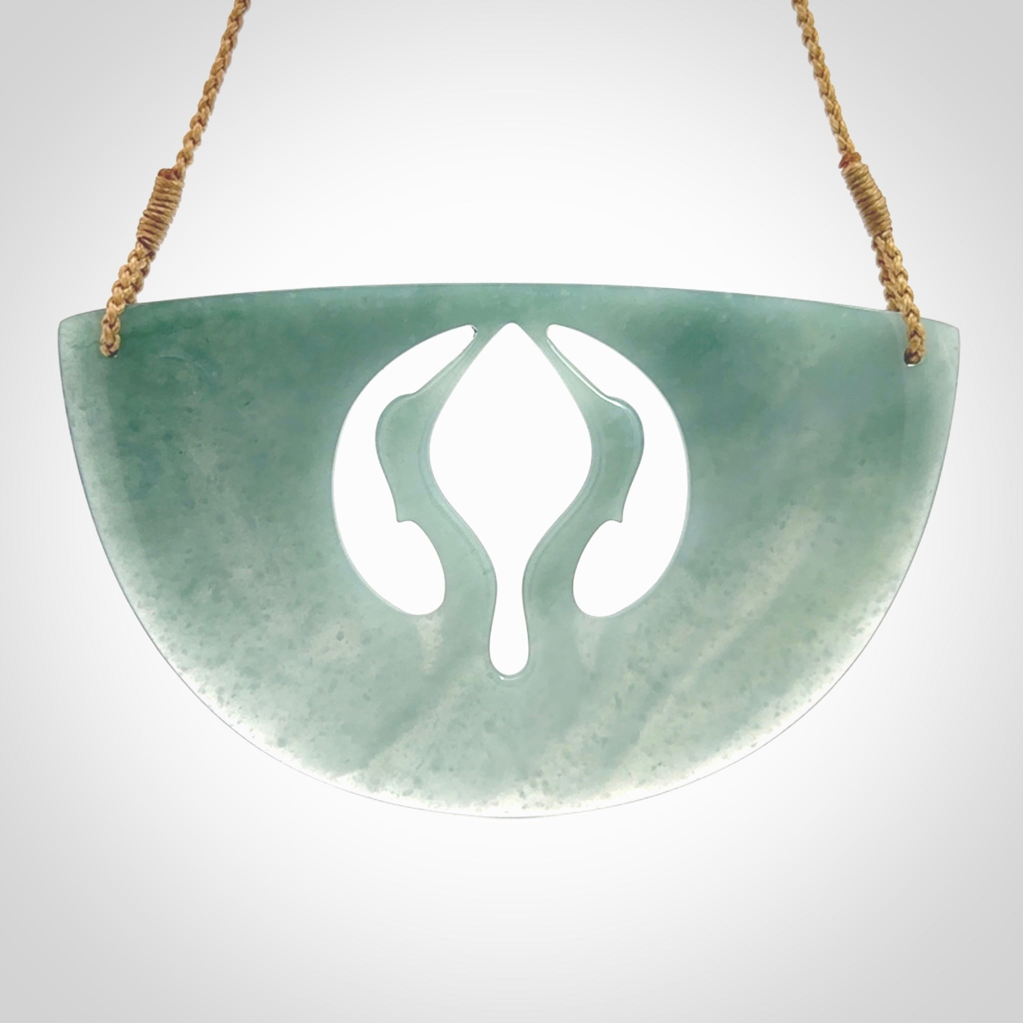 This large piece is a hand carved double Kotuku (white heron) bird breastplate pendant. Kerry carved this from Guatemalan Jade. It is a gorgeous blue colour and is an artistic piece of jewellery. Hand made by Kerry Thompson and delivered to you in a kete pouch.