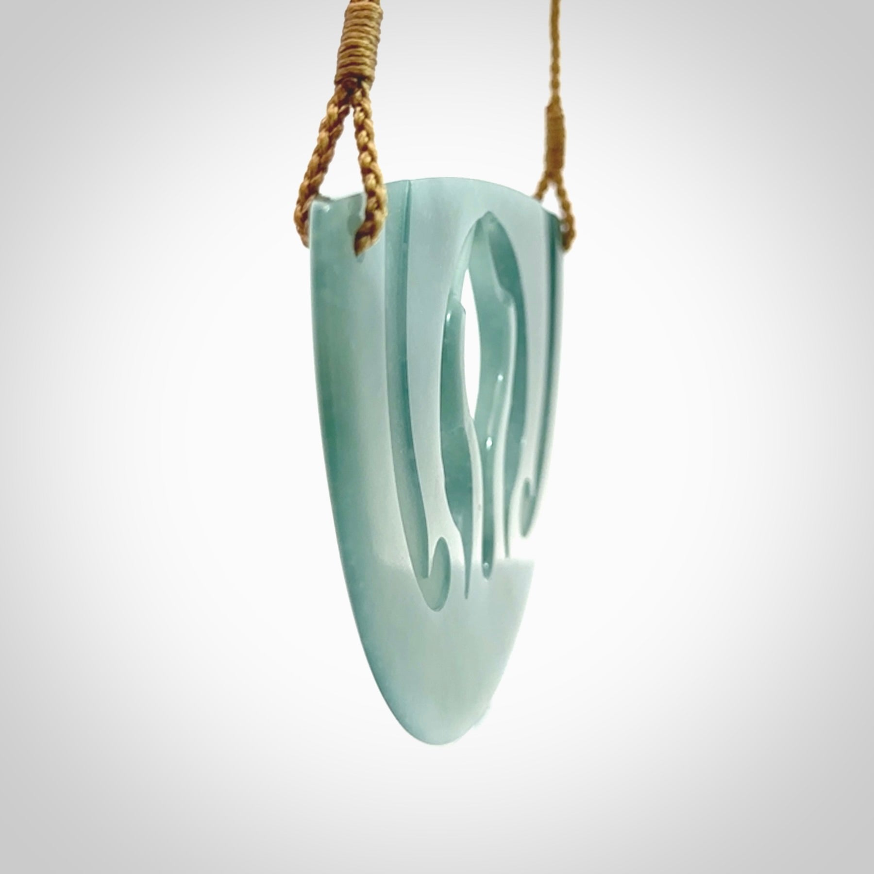 This large piece is a hand carved double Kotuku (white heron) bird breastplate pendant. Kerry carved this from Guatemalan Jade. It is a gorgeous blue colour and is an artistic piece of jewellery. Hand made by Kerry Thompson and delivered to you in a kete pouch.