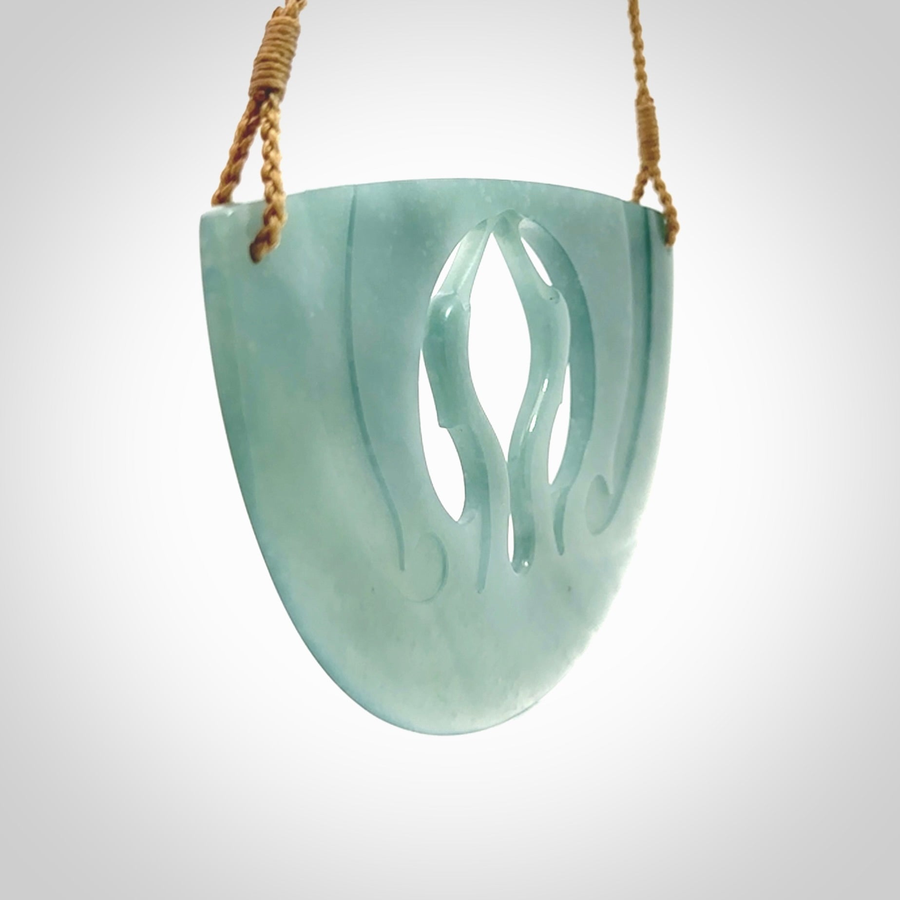 This large piece is a hand carved double Kotuku (white heron) bird breastplate pendant. Kerry carved this from Guatemalan Jade. It is a gorgeous blue colour and is an artistic piece of jewellery. Hand made by Kerry Thompson and delivered to you in a kete pouch.