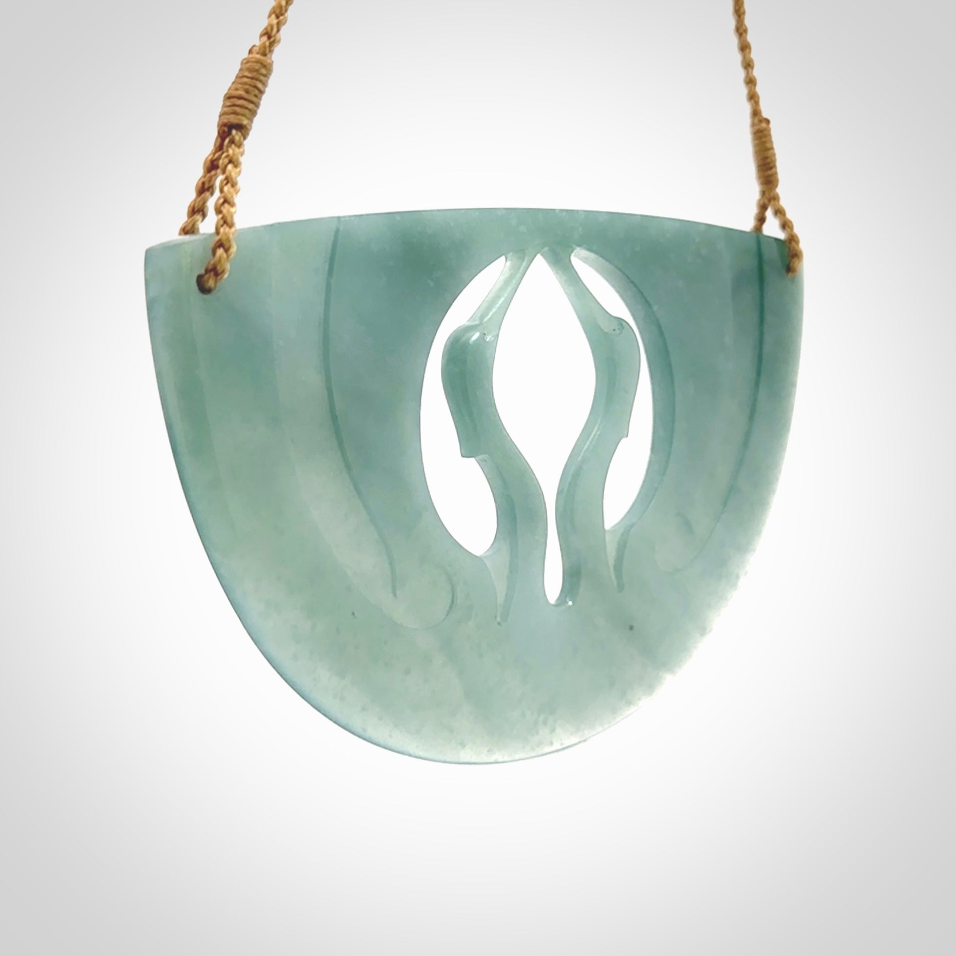 This large piece is a hand carved double Kotuku (white heron) bird breastplate pendant. Kerry carved this from Guatemalan Jade. It is a gorgeous blue colour and is an artistic piece of jewellery. Hand made by Kerry Thompson and delivered to you in a kete pouch.