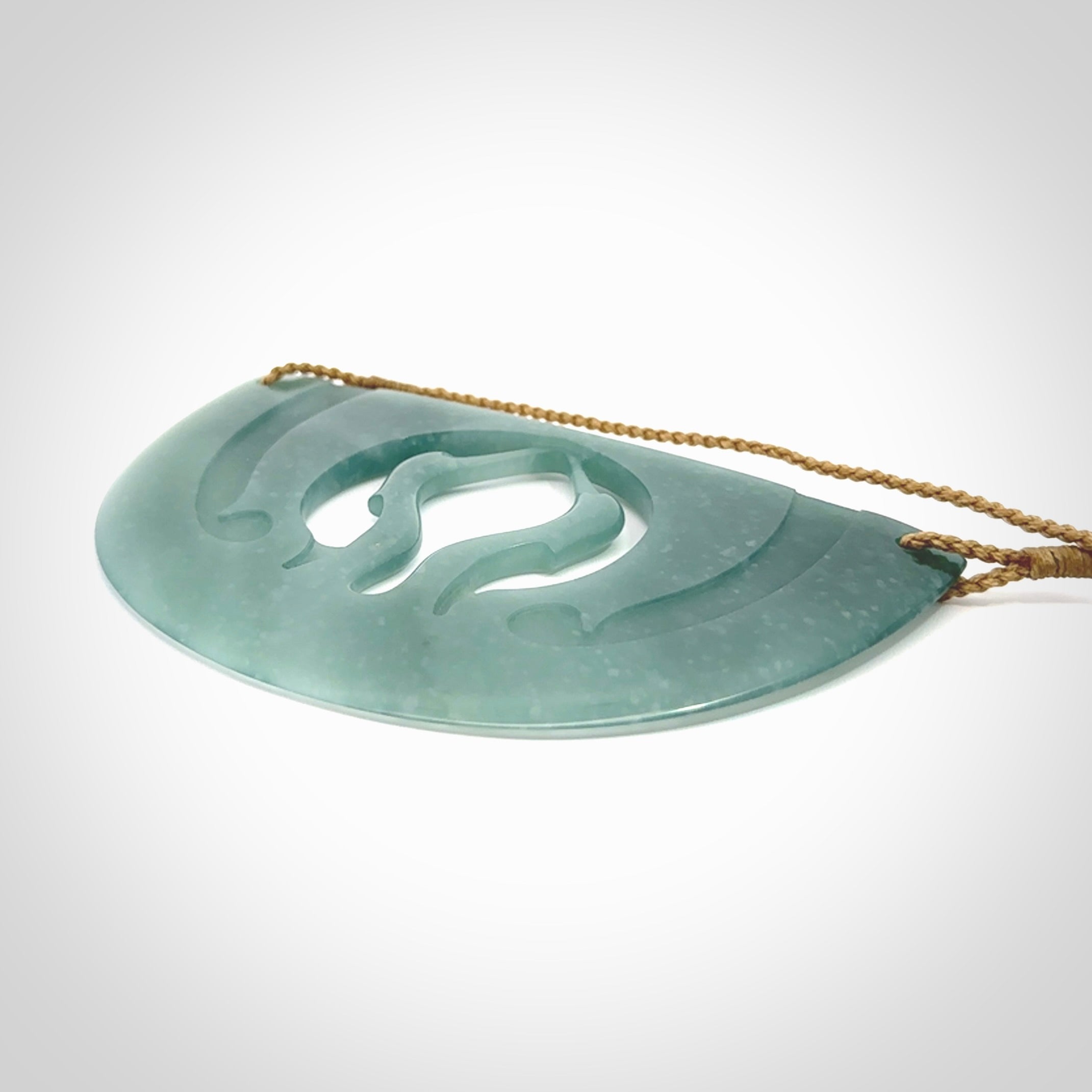 This large piece is a hand carved double Kotuku (white heron) bird breastplate pendant. Kerry carved this from Guatemalan Jade. It is a gorgeous blue colour and is an artistic piece of jewellery. Hand made by Kerry Thompson and delivered to you in a kete pouch.