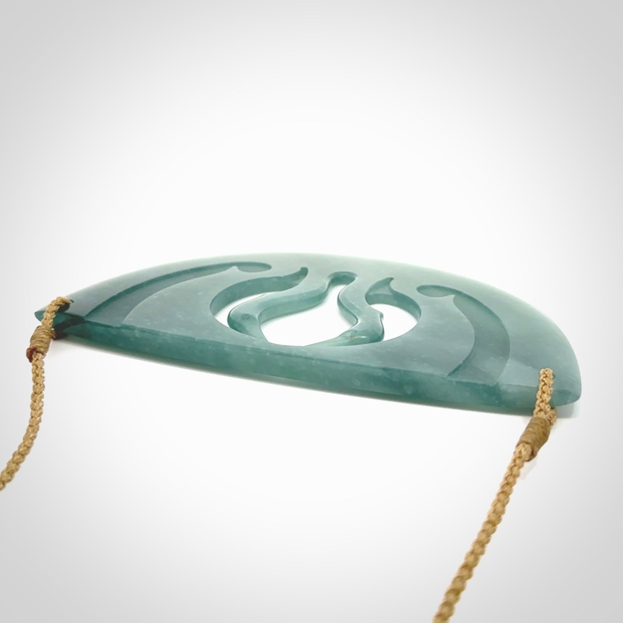 This large piece is a hand carved double Kotuku (white heron) bird breastplate pendant. Kerry carved this from Guatemalan Jade. It is a gorgeous blue colour and is an artistic piece of jewellery. Hand made by Kerry Thompson and delivered to you in a kete pouch.