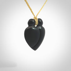 This is a hand carved love heart pendant made from a gorgeous and striking piece of black jade stone. This is a superbly carved and very unique piece of contemporary jewellery. For sale online from NZ Pacific.