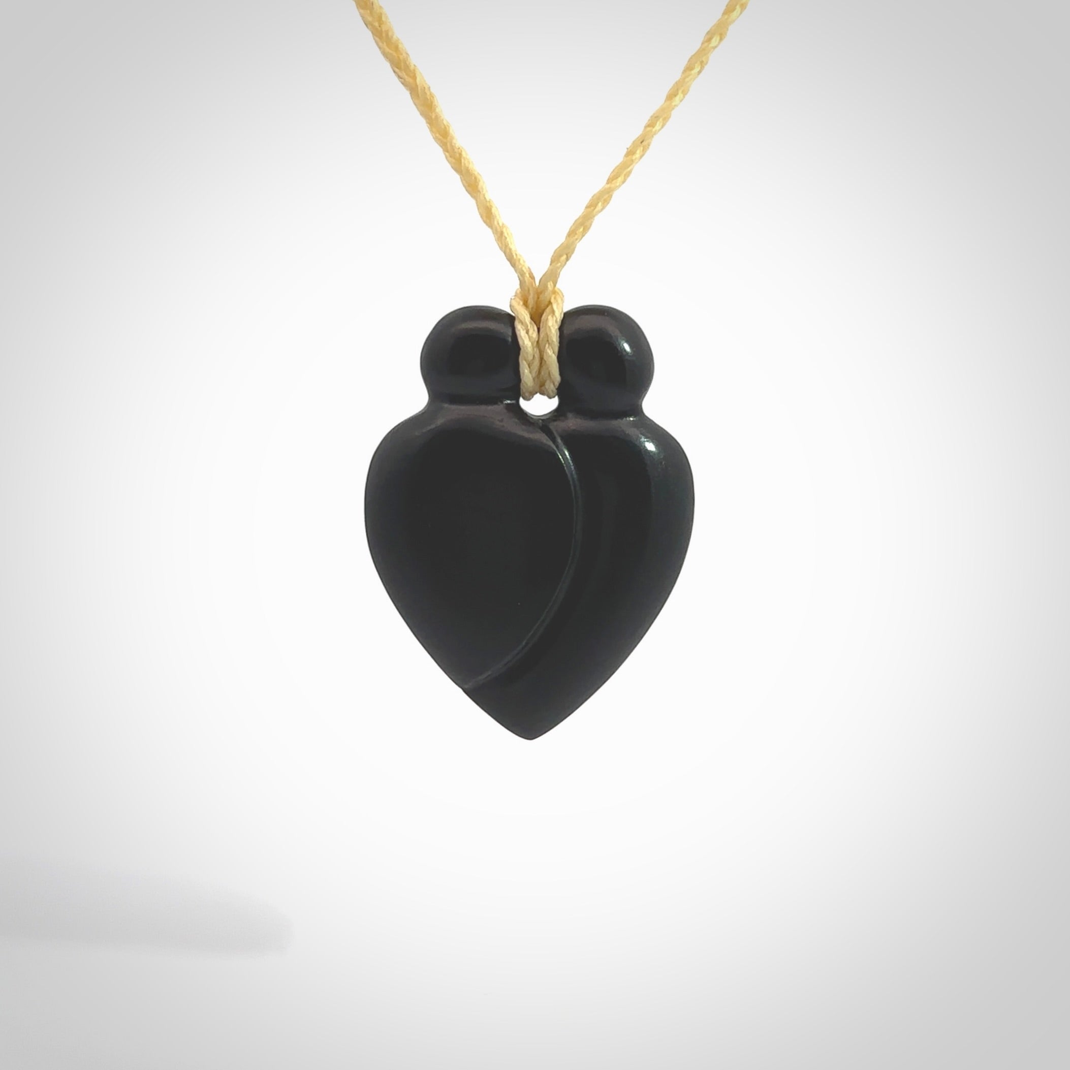 This is a hand carved love heart pendant made from a gorgeous and striking piece of black jade stone. This is a superbly carved and very unique piece of contemporary jewellery. For sale online from NZ Pacific.