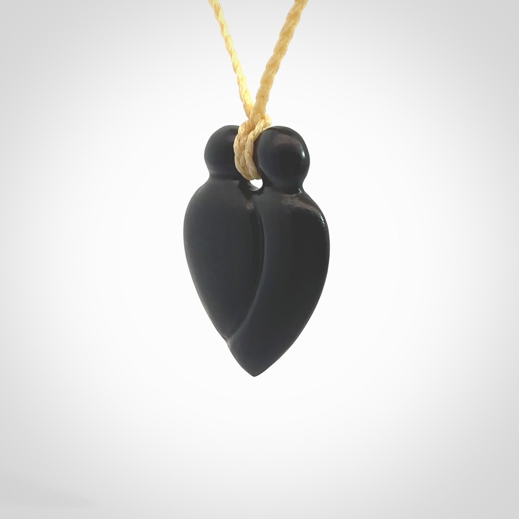 This is a hand carved love heart pendant made from a gorgeous and striking piece of black jade stone. This is a superbly carved and very unique piece of contemporary jewellery. For sale online from NZ Pacific.