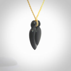 This is a hand carved love heart pendant made from a gorgeous and striking piece of black jade stone. This is a superbly carved and very unique piece of contemporary jewellery. For sale online from NZ Pacific.