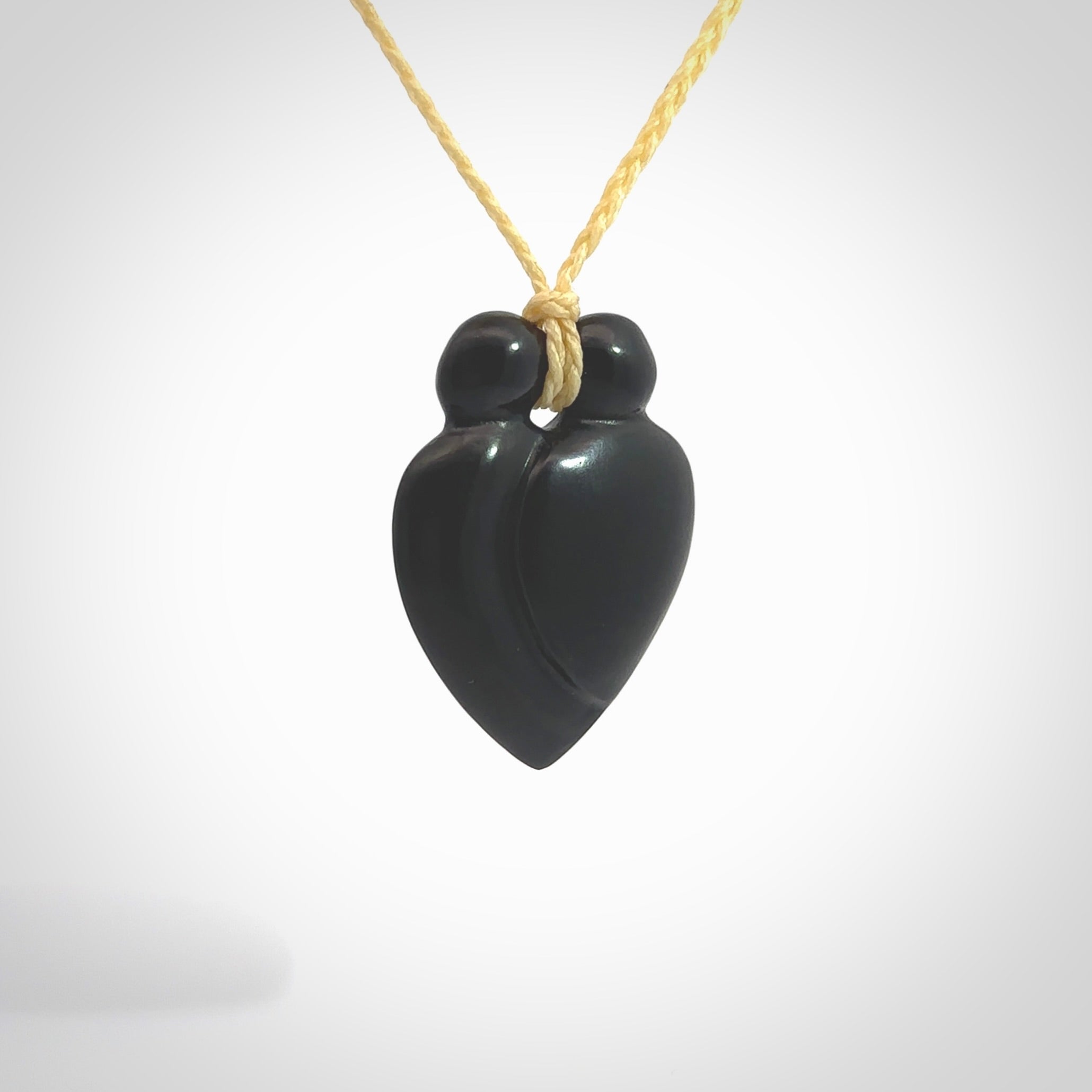 This is a hand carved love heart pendant made from a gorgeous and striking piece of black jade stone. This is a superbly carved and very unique piece of contemporary jewellery. For sale online from NZ Pacific.