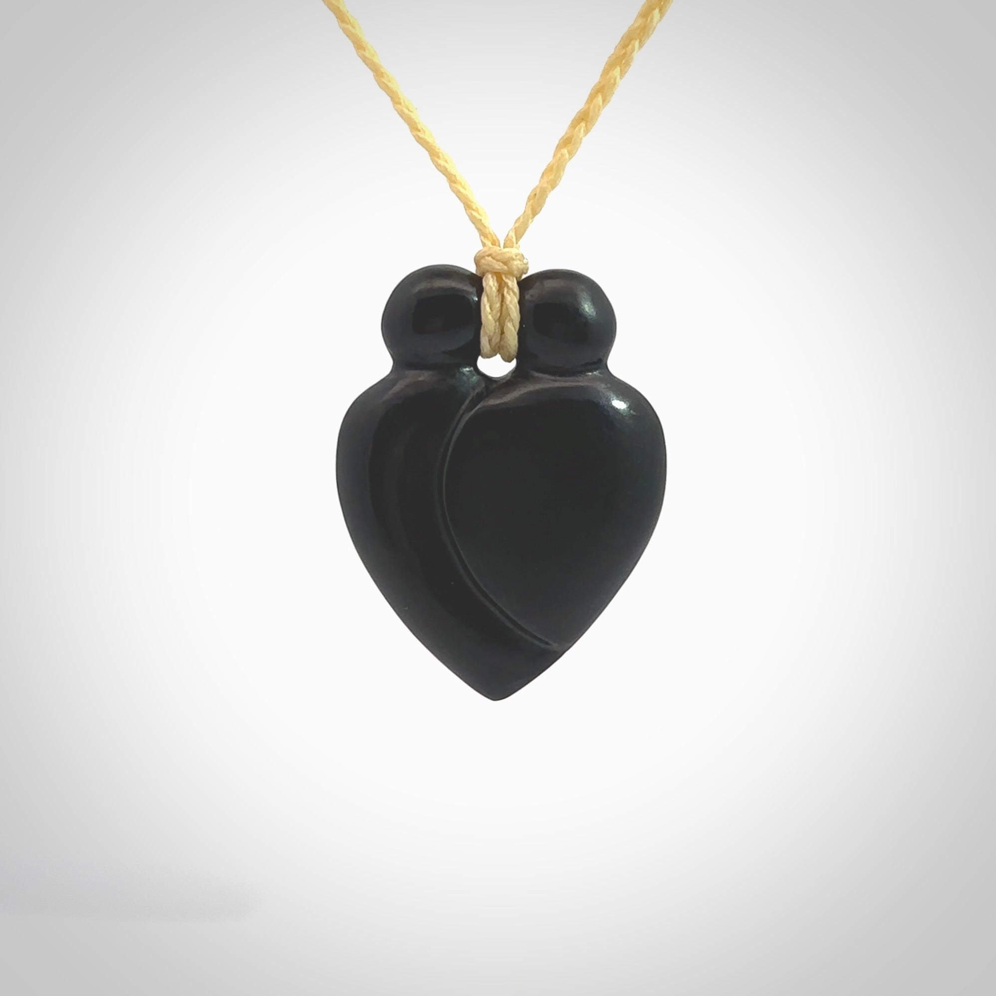 This is a hand carved love heart pendant made from a gorgeous and striking piece of black jade stone. This is a superbly carved and very unique piece of contemporary jewellery. For sale online from NZ Pacific.