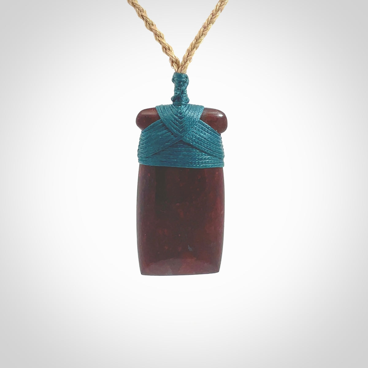 This is a beautiful hand carved Red Jasper Stone toki pendant. A really cool piece that is made from this rare and beautiful material. The red jasper has a very distinctive look and each piece is different. We ship this worldwide and the cost of shipping is included in the price. Provided with adjustable cords and packaged in a woven kete pouch.