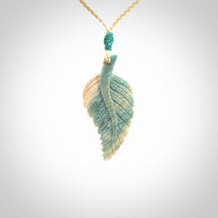 Hand carved blue Mammoth Tusk feather pendant with hand plaited adjustable cord. Woolly Mammoth tusk feather necklace. Hand carved by NZ Pacific. Art to Wear.