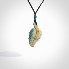 Hand carved blue Mammoth Tusk feather pendant with hand plaited adjustable cord. Woolly Mammoth tusk feather necklace. Hand carved by NZ Pacific. Art to Wear.