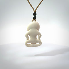 This little bone tiki has been carved to look and feel great. It has pāua shell eyes and is provided with a hand plaited cord. A gorgeous and small traditional piece that is great for children.