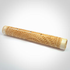 A traditional hand carved Māori flute. This piece is made from bone and is a fully functioning musical instrument and can be played. Beautiful ethnic art hand made by NZ Pacific.