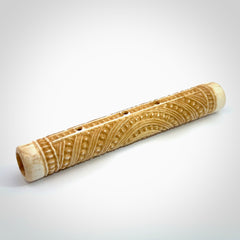 A traditional hand carved Māori flute. This piece is made from bone and is a fully functioning musical instrument and can be played. Beautiful ethnic art hand made by NZ Pacific.