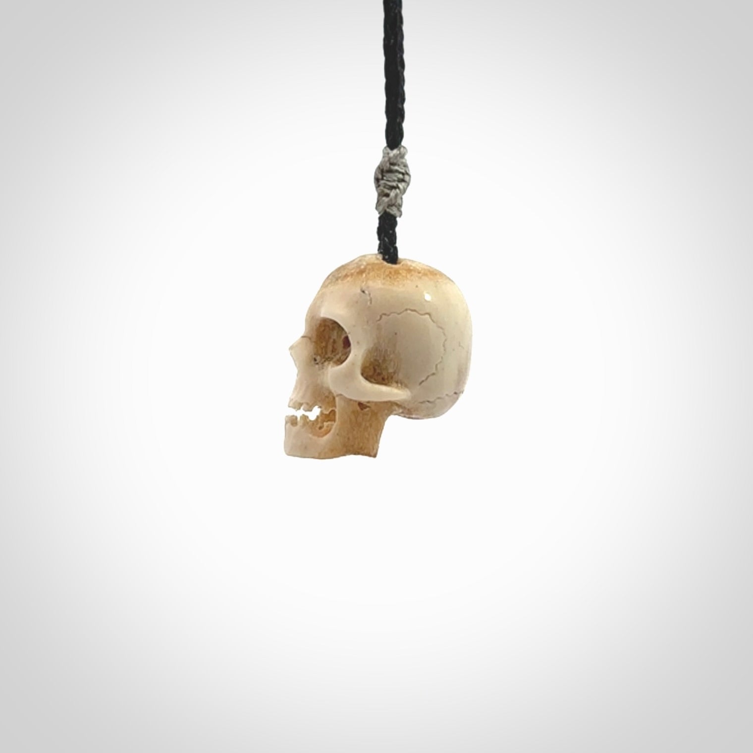 These are handmade skull pendants carved from deer antler. A fantastic piece if you like skulls and would like a medium sized piece. The cord is adjustable so you can wear this where it suits you best. We ship these free worldwide.