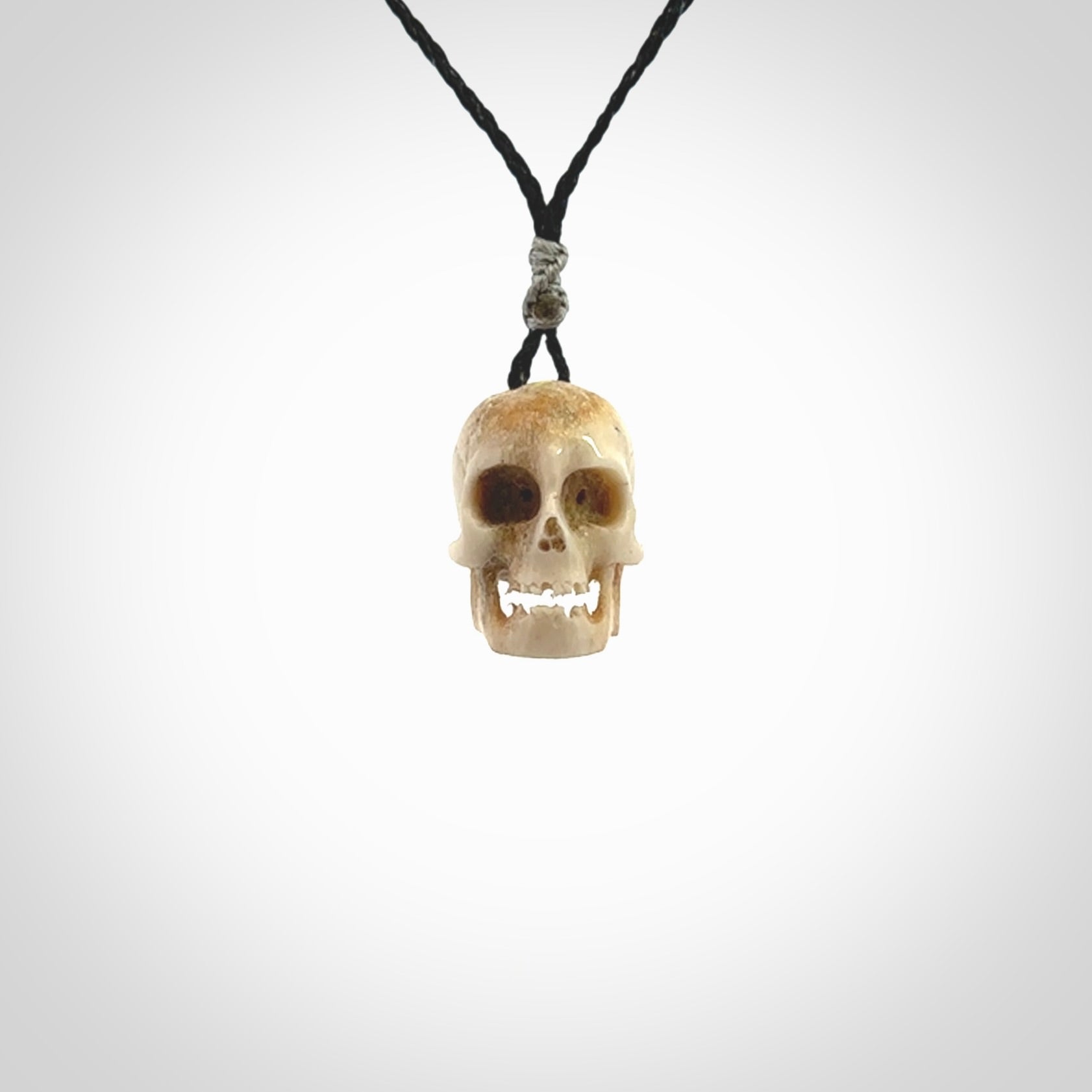 These are handmade skull pendants carved from deer antler. A fantastic piece if you like skulls and would like a medium sized piece. The cord is adjustable so you can wear this where it suits you best. We ship these free worldwide.