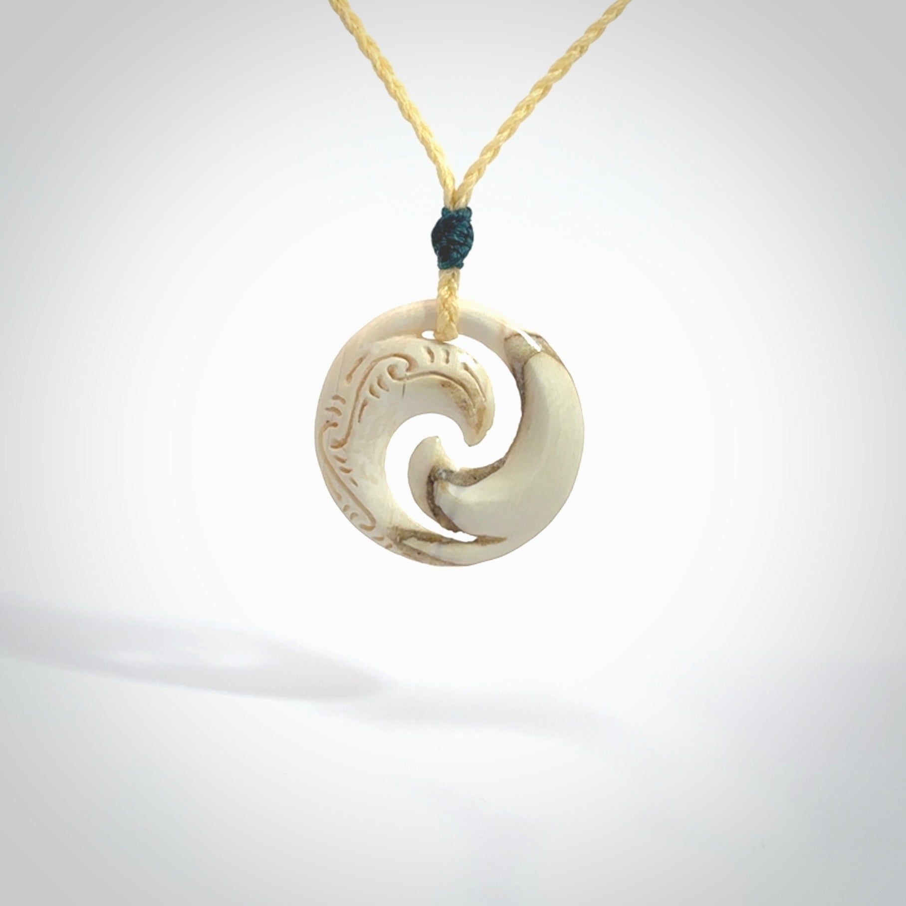 Carved koru pendant hand made in Woolly Mammoth tusk. These are a variety of colours from cream to dark brown.