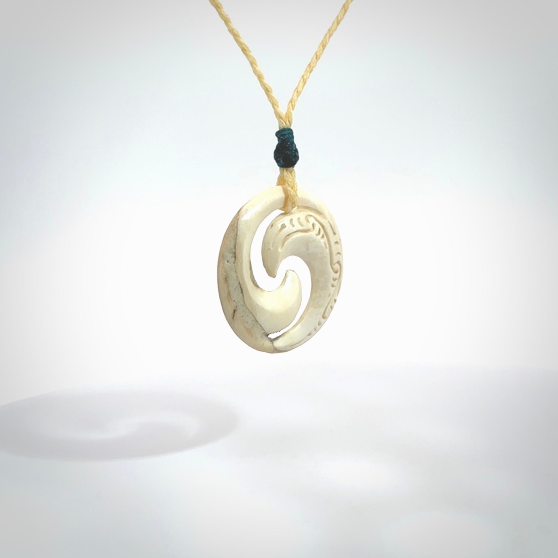 Carved koru pendant hand made in Woolly Mammoth tusk. These are a variety of colours from cream to dark brown.