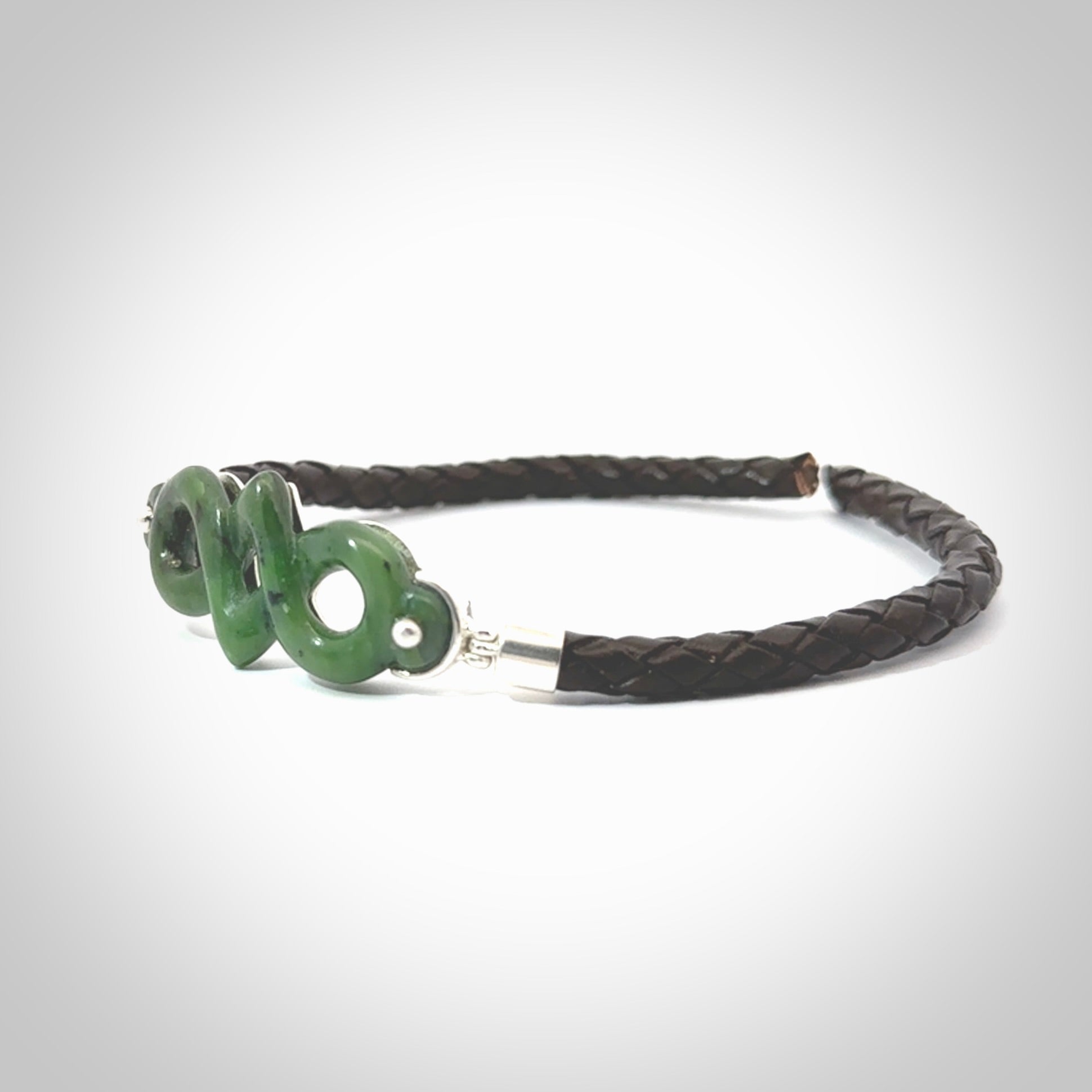 Hand carved eternity bracelet from Jade, green stone. This is an absolutely beautiful piece of wrist jewellery, hand made by NZ Pacific. We provide this with Free Postage Worldwide.