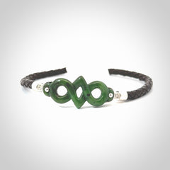 Hand carved eternity bracelet from Jade, green stone. This is an absolutely beautiful piece of wrist jewellery, hand made by NZ Pacific. We provide this with Free Postage Worldwide.