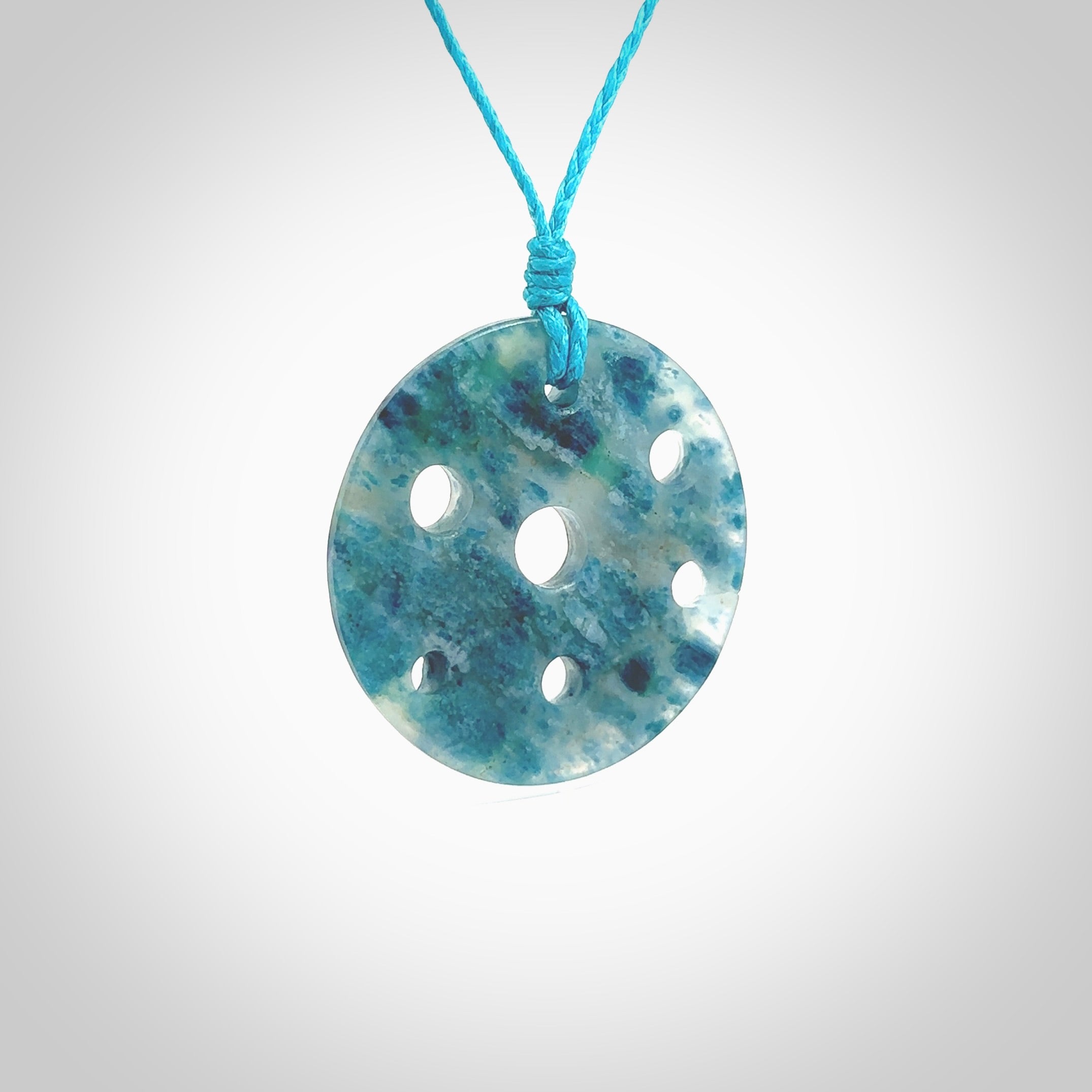 This is a handcrafted aotea stone contemporary disc pendant. This is a wonderful work of art hand made by Ana Krakosky. We ship this worldwide for free and are happy to answer any questions that you may have about these or other products on our website.