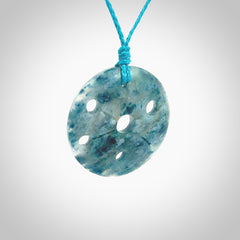 This is a handcrafted aotea stone contemporary disc pendant. This is a wonderful work of art hand made by Ana Krakosky. We ship this worldwide for free and are happy to answer any questions that you may have about these or other products on our website.