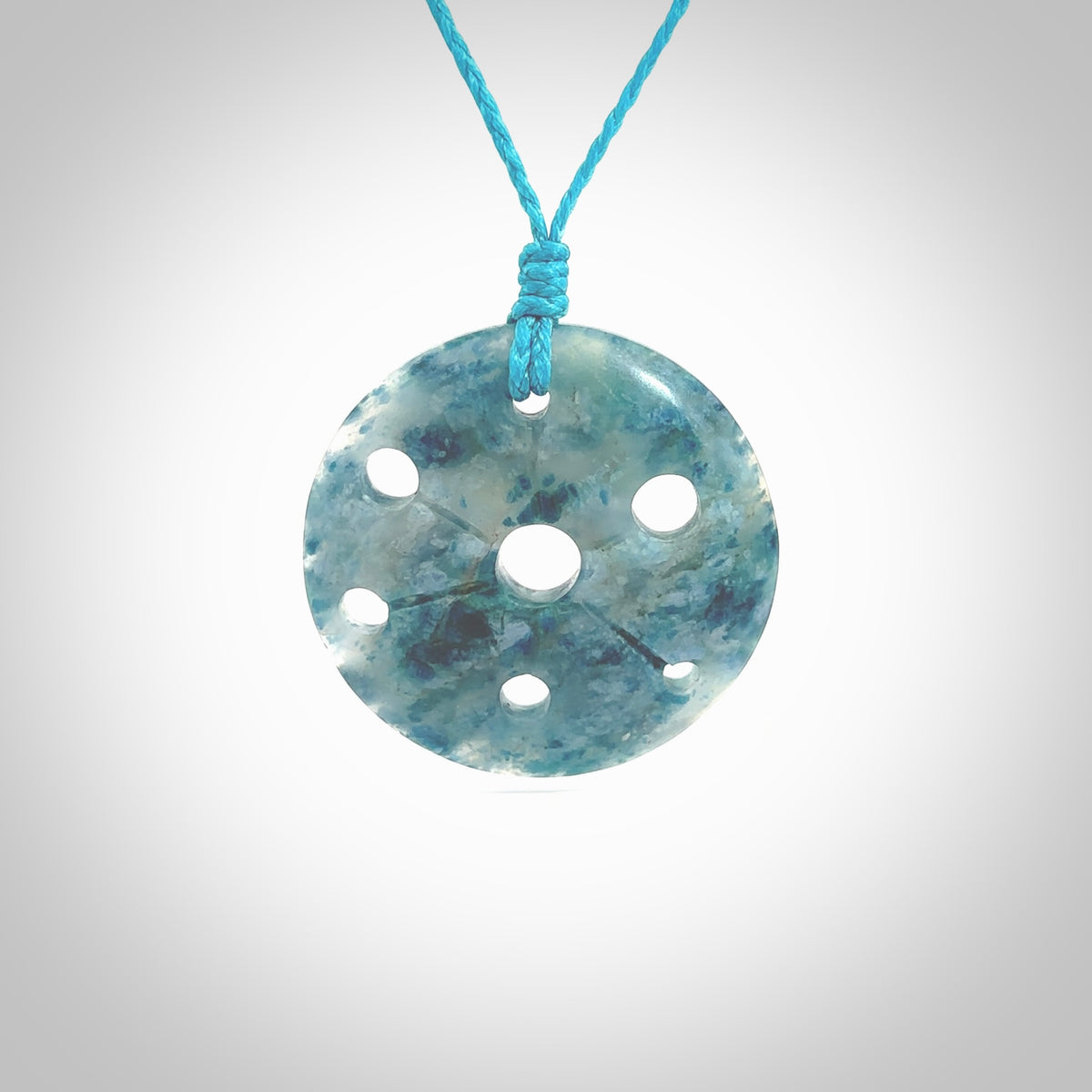 This is a handcrafted aotea stone contemporary disc pendant. This is a wonderful work of art hand made by Ana Krakosky. We ship this worldwide for free and are happy to answer any questions that you may have about these or other products on our website.