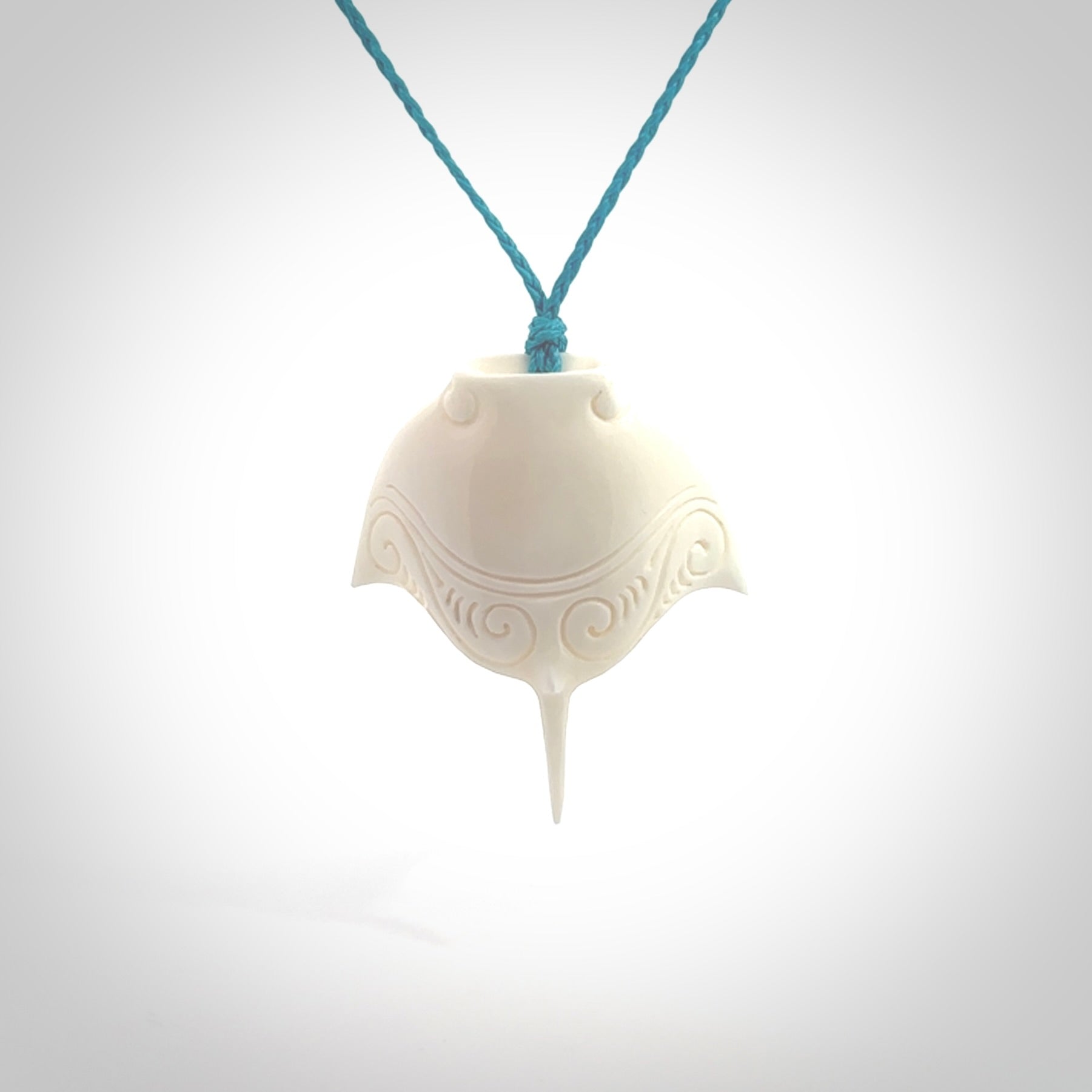 Hand carved bone manta ray pendant. Moana pendants carved by NZ Pacific. Hand made art to wear for sale online.