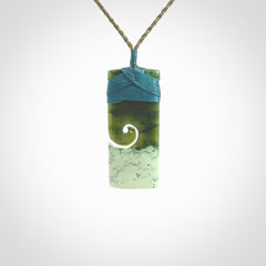 New Zealand jade toki koru pendant. Hand carved in New Zealand. Hand made jewellery. Provided with an adjustable cord.