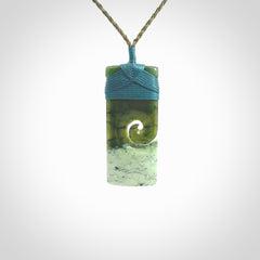 New Zealand jade toki koru pendant. Hand carved in New Zealand. Hand made jewellery. Provided with an adjustable cord.