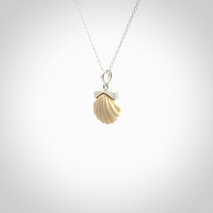 Hand made woolly mammoth tusk fanshell necklace with Sterling Silver. Mammoth tusk fanshell pendant with Sterling silver surround and chain. Made by NZ Pacific and sale online only.