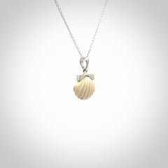 Hand made woolly mammoth tusk fanshell necklace with Sterling Silver. Mammoth tusk fanshell pendant with Sterling silver surround and chain. Made by NZ Pacific and sale online only.