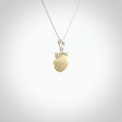 Hand made woolly mammoth tusk fanshell necklace with Sterling Silver. Mammoth tusk fanshell pendant with Sterling silver surround and chain. Made by NZ Pacific and sale online only.