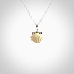 Hand made woolly mammoth tusk fanshell necklace with Sterling Silver. Mammoth tusk fanshell pendant with Sterling silver surround and chain. Made by NZ Pacific and sale online only.