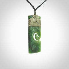 New Zealand jade toki koru pendant. Hand carved in New Zealand. Hand made jewellery. Provided with an adjustable cord.