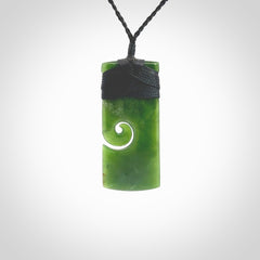 New Zealand jade toki koru pendant. Hand carved in New Zealand. Hand made jewellery. Provided with an adjustable cord.