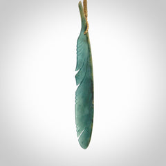 A hand carved large New Zealand Flower Jade Haast Eagle feather necklace. The cord is a tan colour and is a fixed length. A large sized hand made Jade Haast eagle feather pendant by New Zealand artist Kerry Thompson. One off work of art to wear.