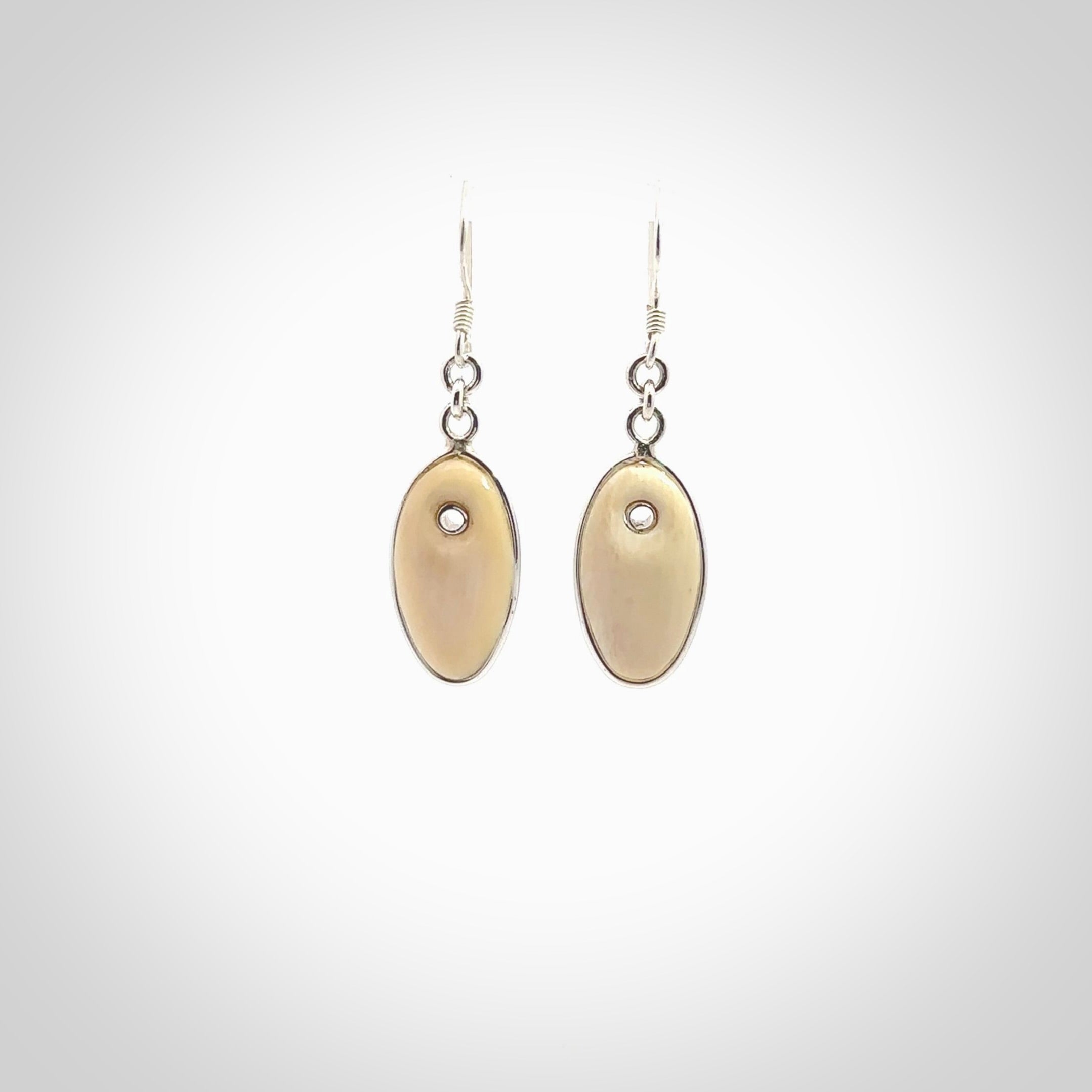 Hand carved woolly mammoth tusk earrings. Hand made by NZ Pacific for sale online.