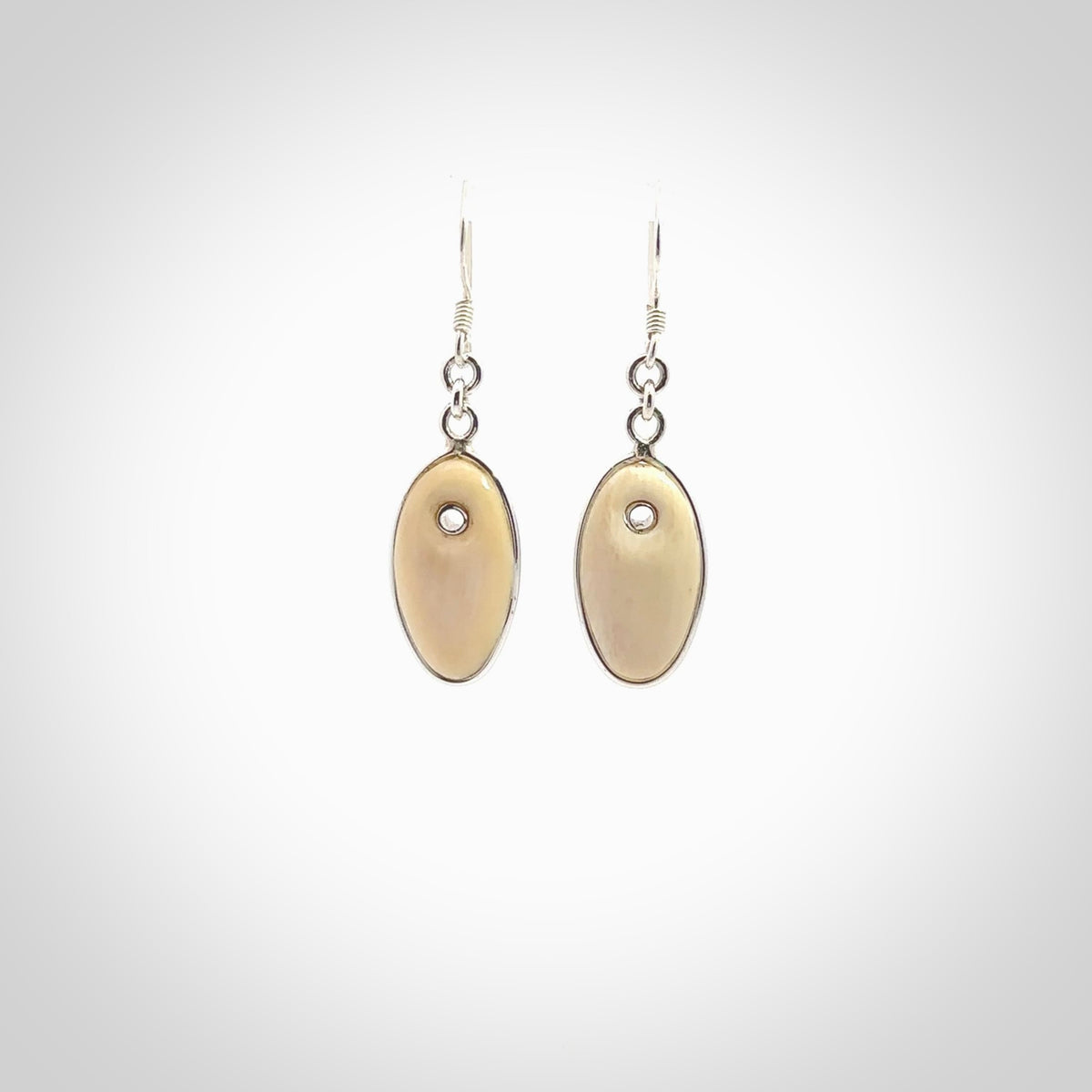 Hand carved woolly mammoth tusk earrings. Hand made by NZ Pacific for sale online.