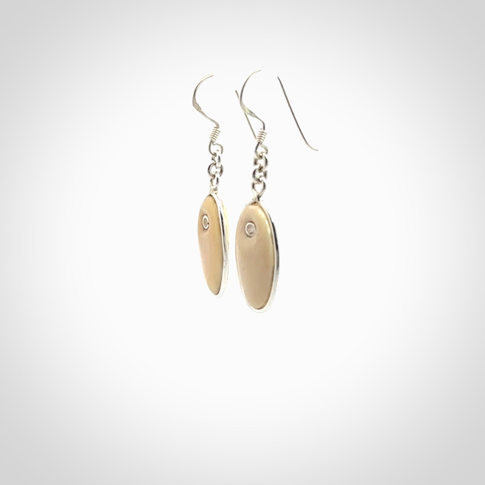 Hand carved woolly mammoth tusk earrings. Hand made by NZ Pacific for sale online.