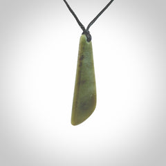 Hand carved small New Zealand Jade drop pendant. This pendant has been carved from New Zealand  jade by NZ Pacific. We sell this piece with an adjustable cord deliver to you with no extra cost for postage.