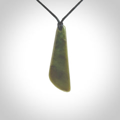 Hand carved small New Zealand Jade drop pendant. This pendant has been carved from New Zealand  jade by NZ Pacific. We sell this piece with an adjustable cord deliver to you with no extra cost for postage.