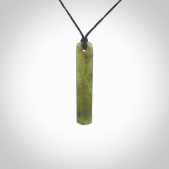 This is a lovely New Zealand Totoweka Jade, pounamu drop pendant. It is bound with an adjustable black coloured cord which is length adjustable. Free worldwide shipping.