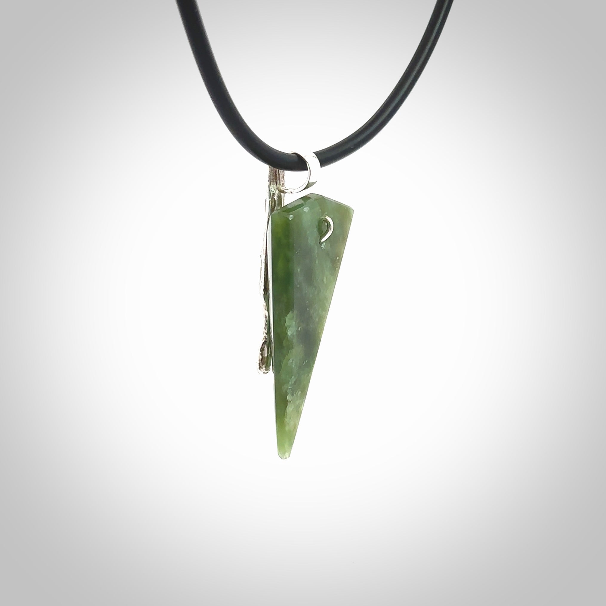 A photo of a New Zealand Jade drop pendant with sterling silver. This is a stylish statement piece - hand crafted here in New Zealand by Ana Krakosky. Unique Art to Wear. Gifts for all lovers of hand made Art to Wear.