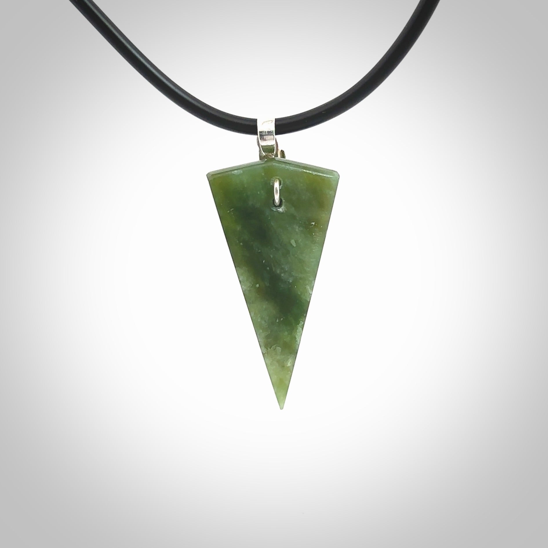 A photo of a New Zealand Jade drop pendant with sterling silver. This is a stylish statement piece - hand crafted here in New Zealand by Ana Krakosky. Unique Art to Wear. Gifts for all lovers of hand made Art to Wear.